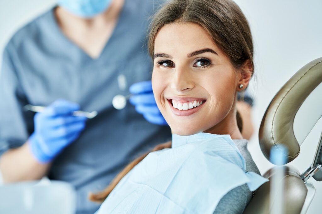 Male dentist and woman in dentist office